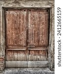 Small photo of Image of a double door dating back to the 19th century, photographed in a medieval village in the Ligurian hinterland, in Italy.