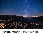 Passo dello Stelvio - Stelvio pass in Italy, Ortler Alps, Italy - curvy road through mountains at night with starry sky