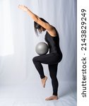 Pilates With A Ball. A Woman Is ...