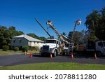 Small photo of Walkerston, Queensland, Australia - 22 July 2021; Electricity power workers or linesmen replacing a damaged electrical supply pole in a suburban street in North Queensland.