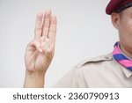 Small photo of Hand sign code of scout. Concept, Scout activity that teaching in schools Thailand. Hand signs and symbols which meaningful in scouting lesson. Show hand sign for oath.