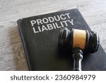 Closeup image of judge gavel and text PRODUCT LIABILITY on table.