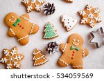 beautiful Christmas background with gingerbread men, Christmas trees and snowflakes with pine cones