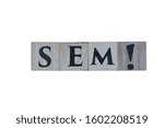 Wooden cubes showing the abbreviation SEM (Search Engine Marketing) with white background, for designs and layouts