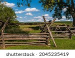 Wooden fences lining part of the Antietam National Battlefield in Sharpsburg, Maryland, USA on a sunny summer day
