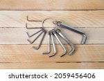 Set of hex keys on a ring on the wooden background