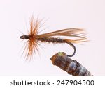 Small photo of Macro shot of a brown caddish fly dry fly fishing lure used for trout fishing