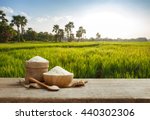 Asian uncooked white rice with the rice field background