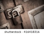 lock on the door of an old farmhouse . true village style.