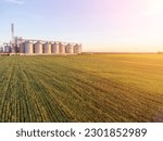 Small photo of Modern metal silos on agro-processing and manufacturing plant. Aerial view of Granary elevator processing drying cleaning and storage of agricultural products, flour, cereals and grain. Nobody.