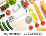 Food supplies for the period of quarantine on white background. Set of grocery items from canned food, vegetables, pasta, cereal. Food delivery concept. Donation concept. Top view.