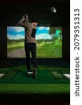 A Man Playing Screen Golf. Golf ...