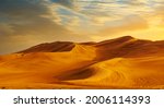 Small photo of Golden Sand Dune Desert Landscape. Beautiful sunset over the sand dunes in the Al Madam Desert, Sharjah, UAE.