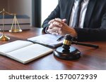 Professional male lawyer or counselor working with legal case document contract in office, law and justice, attorney, lawsuit concept.