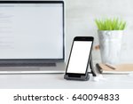 phone mobile showing white blank screen on work desk