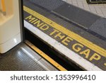 Small photo of “MIND THE GAP” phrase denoted by the famous London Underground yellow words symbolising the gender pay gap and London tourism