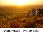 Beautiful landscape with steep limestone rocks on the hillside of Table Mountain in Pálava Protected Landscape Area in Czech republic at sunset
