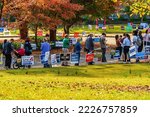 Small photo of Raleigh, North Carolina USA-11 05 2022: Amidst a Forest of Campaign Signs, Some with Negative Messages, Voters Line up for the 2022 Midterm Election.