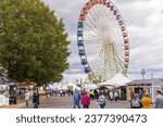 Small photo of Raleigh, North Carolina USA-10 17 2023: A Giant Ferris Wheel on the Midway at the North Carolina State Fair.