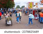 Small photo of Raleigh, North Carolina USA-10 17 2023: Walking Down the Midway at the North Carolina State Fair in 2023.