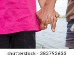 Small photo of middle age couple hold hand accost, philander