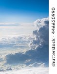 Small photo of Panoramic view above the clouds where their training is, the passage of the sun's rays and the earth insinuates many meters below