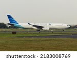 Small photo of Boyolali, Central Java, Indonesia-November 29, 2019: Garuda Indonesia, PK-GPX, Airbus A330-343, backtrack taxiing to runway 26 of Adi Soemarmo Airport for take off