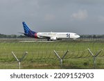 Small photo of Boyolali, Central Java, Indonesia-November 20, 2018: Sriwijaya Air, PK-CMK, Boeing 737-85P, backtrack taxi to runway 26 of Adi Soemarmo Airport
