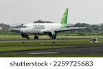 Small photo of Boyolali, Central Java, Indonesia-11 December 2021: Citilink, PK-GLU, Airbus A320-214, landing on Adi Soemarmo Airport. Thrust reversers engaged