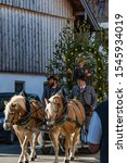 Small photo of Bavarian Townsfolk in traditional outfits riding their horses in the annual Leonhardi Ritt. In Upper Bavaria Unterammergau/Bavaria/Germany 10/27/2019