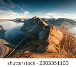 Aerial view of beautiful Mount Eystrahorn with Krossasnesfjall mountain range and sunlight shining on coastline in summer at East of Iceland