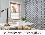 Vintage Home Office with Gold Desk Lamp and Bold Geometric Wallpaper