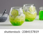 Small photo of Es Kuwut is a type of Balinese cold cocktail drink made from coconut water mixed with coconut shavings, melon or cucumber shavings, basil seeds, lime juice, melon syrup, ice cubes