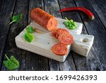 Small photo of Vegan pepperoni sausage made with vital wheat gluten flour (seitan), vegetables and spices. Clean eating, plant based food concept