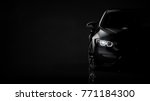Black modern car headlights - front view (with grunge overlay) - 3d illustration