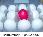 Small photo of All white and one red upstart. Red surrounded by white. Colorful Easter eggs are part of the Easter meal. Easter (Bright Sunday of Christ) is the oldest and most important Christian holiday.