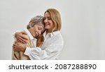 Small photo of Happy loving adult young Caucasian woman hug embrace old mother feel thankful grateful. Smiling caring mature mom and grownup child close moment. Younger and older. Offspring. Copy space.