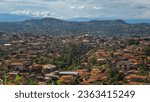 Small photo of Bafoussam, West, Cameroon - July 07, 2023: Beautiful panoramic view of houses in the town of Bafoussam, with mountains in the background.