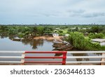 Small photo of Douala, Littoral, Cameroon - April 24, 2021: Beautiful panoramic view of a small village on the banks of the Dibamba River.