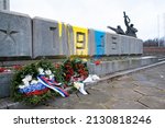 Small photo of RIGA, LATVIA, FEBRUARY 25. 2022 - The so called "Victory monument" defaced with paint in colors of Ukrainian flag.