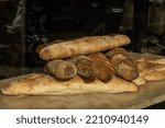 Small photo of Maribo, Denmark Oct 4, 2022 Fresh baguettes in a bakery window.