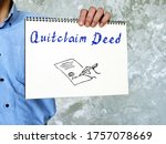 Small photo of Financial concept about Quitclaim Deed with phrase on the piece of paper.