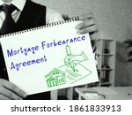 Small photo of Mortgage Forbearance Agreement inscription on the sheet.