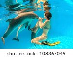 Girl Touches A Dolphin's Nose...