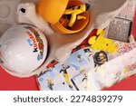 Small photo of Magdalinovka, Ukraine - March 3, 2023. Kinder Surprise chocolate egg and DIY toy
