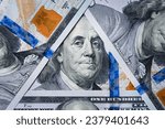 Small photo of Benjamin Franklin's eyes from a hundred-dollar bill. The face of Benjamin Franklin on the hundred dollar banknote, backgrounds, close-up. 100 dollar bill with only eyes of Benjamin Franklin
