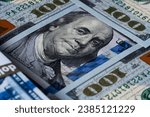 Small photo of Benjamin Franklin's look on a hundred dollar bill. Benjamin Franklin portrait macro usa dollar banknote or bill