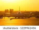 Aircraft In Airport At Sunset
