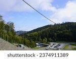        View of the landscape and the Skywalk suspension bridge in Willingen in the Hochsauerland in Germany                        