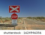 Warning sign at road crossing the Ghan (train) railway line in the desert of outback South Australia 